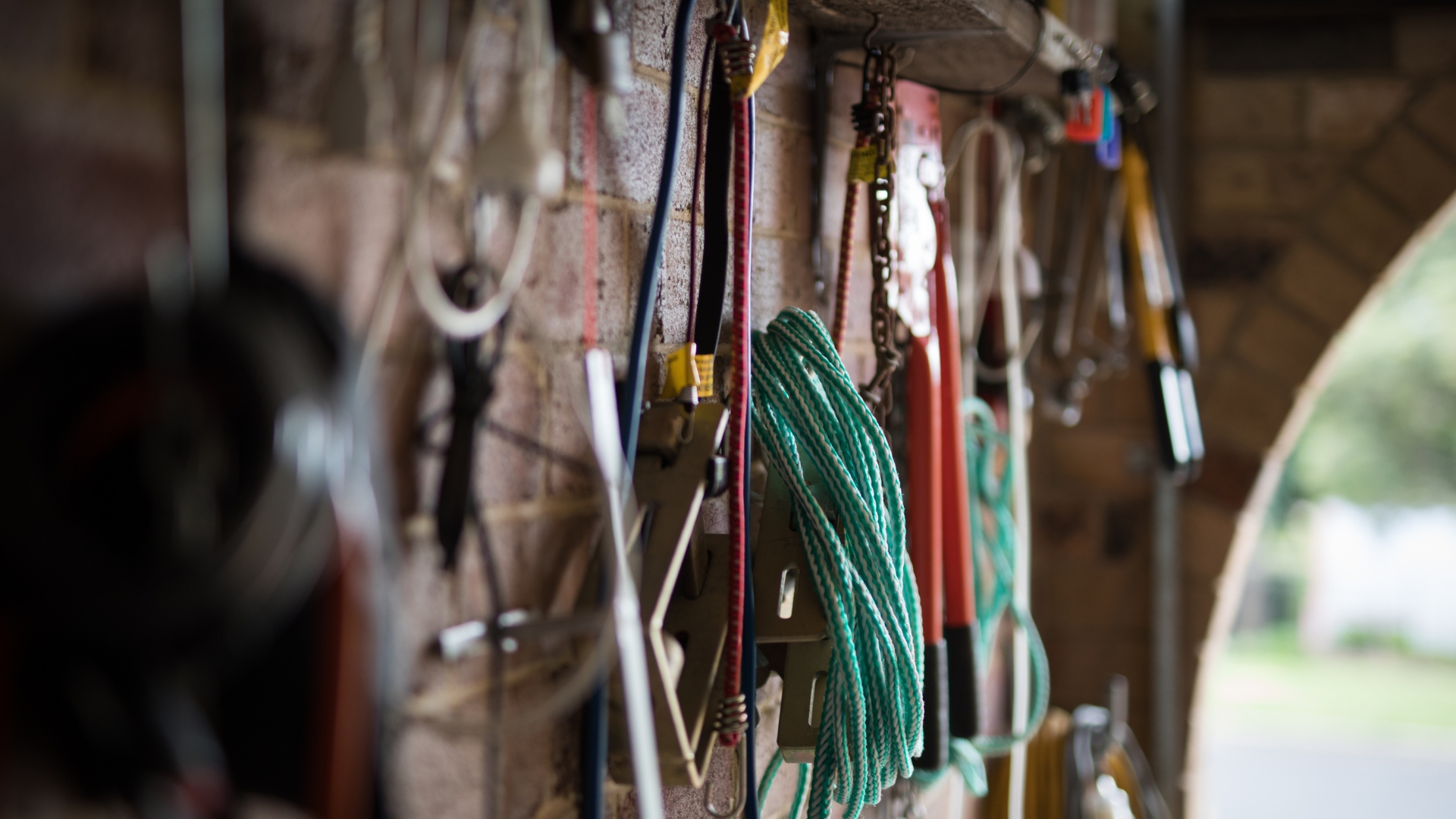 A picture of tools in a garage that are used for garage door repair and installation.