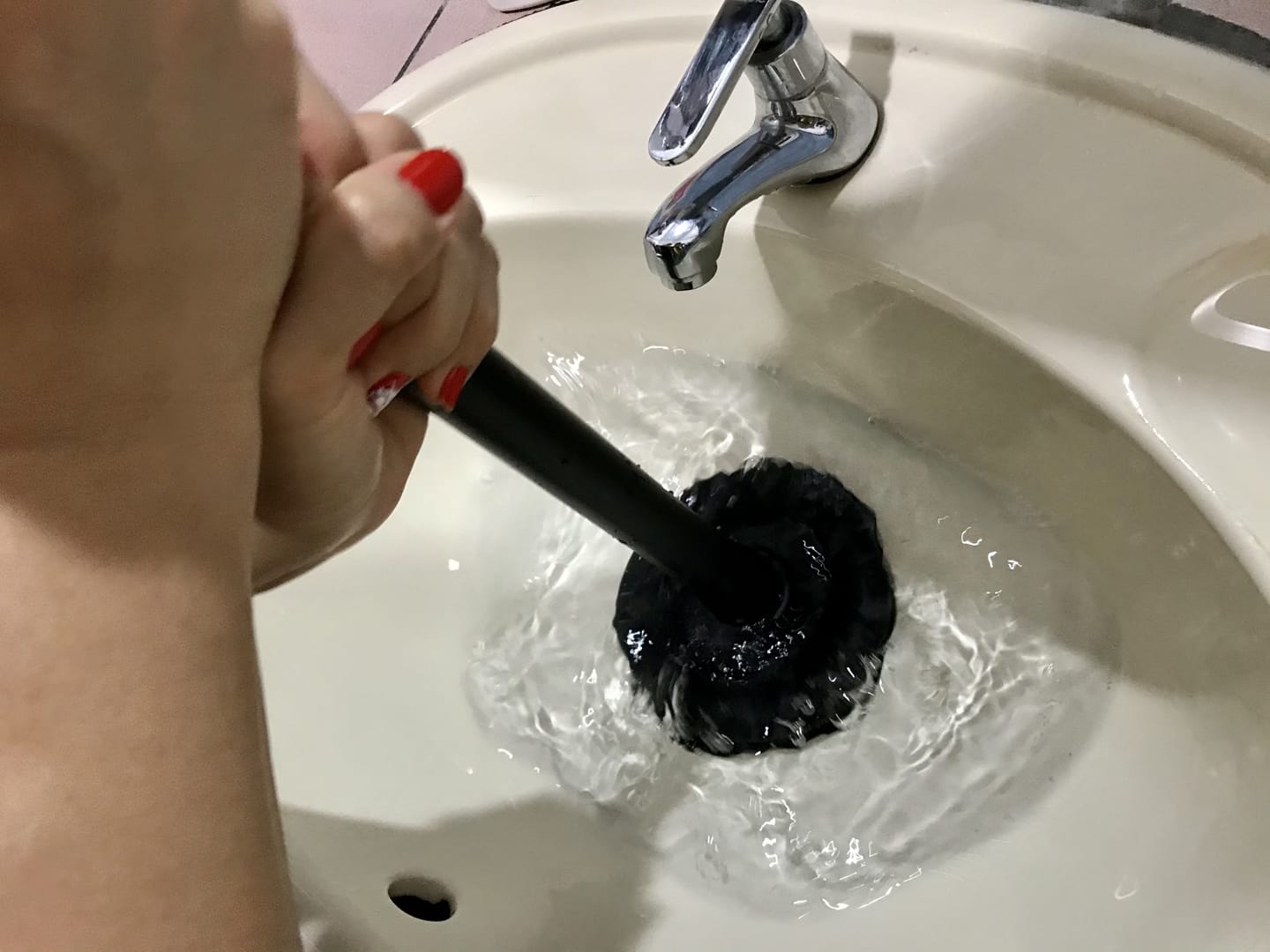 unclogging a sink